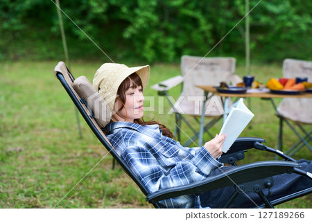 Woman reading a book, camping, leisure, middle-aged, senior 127189266