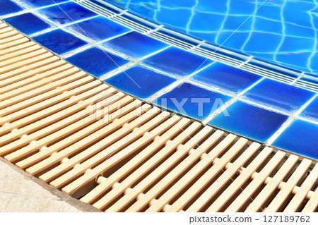 surface of blue swimming pool with water drain surface of blue swimming pool with water drain 127189762
