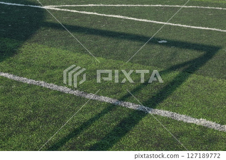 artificial green grass turf sport soccer field with black rubber granules infill 127189772