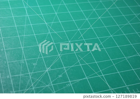 green cutting mat board background with line and scale measure guide pattern for object art design 127189819
