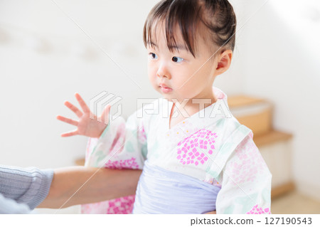 A 2-year-old girl wearing a yukata. Children's yukata dressing 127190543