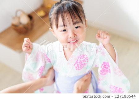 A 2-year-old girl wearing a yukata. Children's yukata dressing 127190544