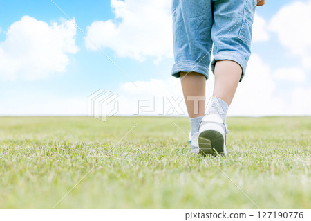 My feet walking on the green hills 127190776