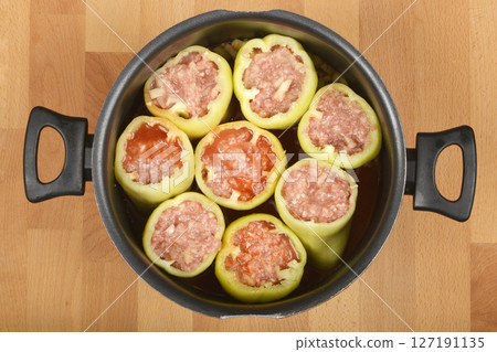 Green bell peppers stuffed with meat and rice mixture 127191135
