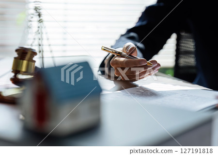 lawyer advises his client about documents. A lawyer explains the law to his client 127191818