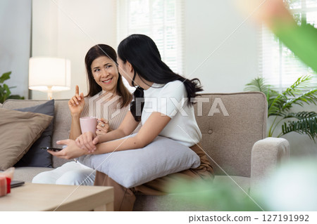 mature daughter and mother sitting together in the morning. mature daughter and retired mother spend weekend together 127191992