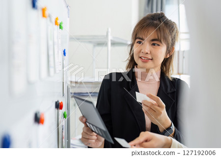 ux developer and ui designer brainstorming interface wireframe design.Creative digital development agency ux developer and ui designer brainstorming interface wireframe design.Creative digital development agency 127192006