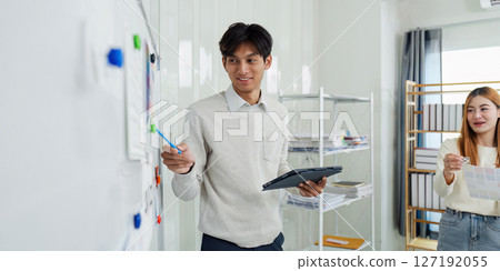 Close up ux developer and ui designer brainstorming interface wireframe design.Creative digital development agency Close up ux developer and ui designer brainstorming interface wireframe design.Creative digital development agency 127192055