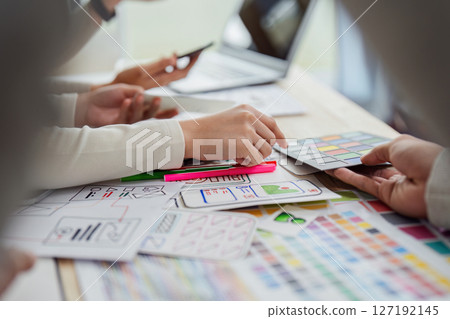 UI designer and UX developer brainstorm idea to design the application appearance in the early stage. Creative digital development agency. UX UI concept UI designer and UX developer brainstorm idea to design the application appearance in the early stage. Creative digital development agency. UX UI concept 127192145