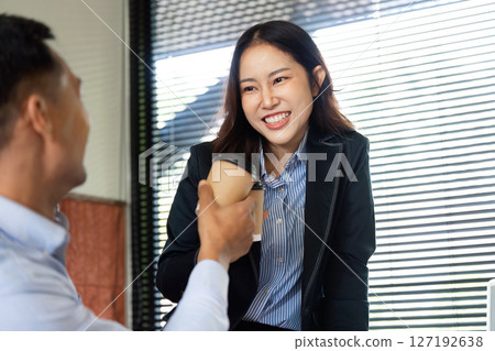 Professional Collaboration. Business partners sharing a joyful moment with coffee. Professional Collaboration. Business partners sharing a joyful moment with coffee. 127192638