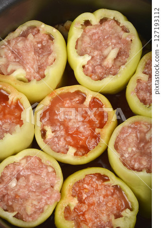 Green bell peppers stuffed with meat and rice mixture Green bell peppers stuffed with meat and rice mixture 127193112