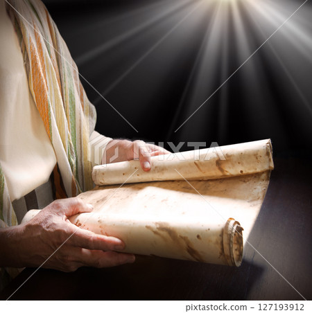 Man's hans holding a scroll 127193912
