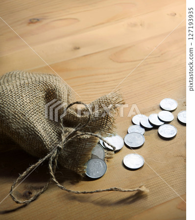 Silver coins in the bag 127193935