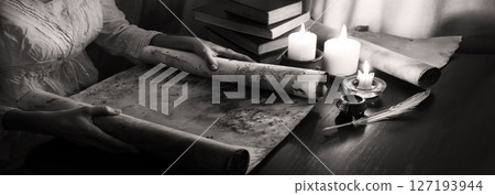 Hands with an old scroll Hands with an old scroll 127193944