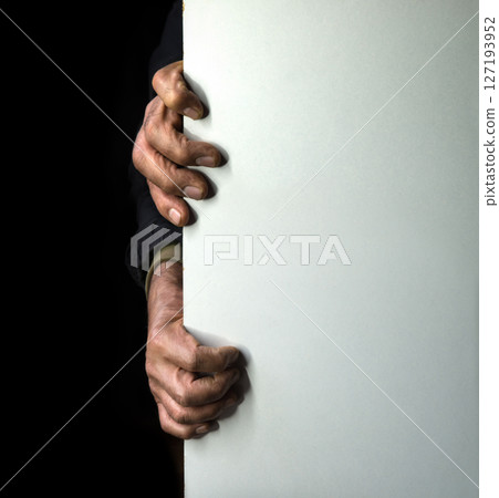 Old man hides after the wall Old man hides after the wall 127193952