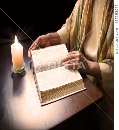 Man reading an old bible 127193961