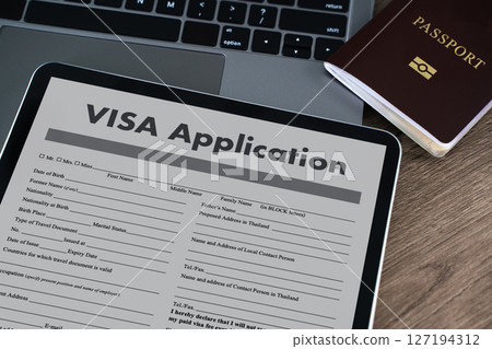Visa application digital tablet displaying visa  127194312