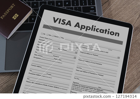 Visa application digital tablet displaying visa  127194314