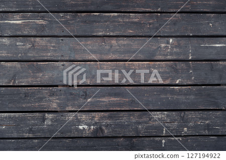 Aged wooden planks with rough texture and natural imperfections Aged wooden planks with rough texture and natural imperfections 127194922