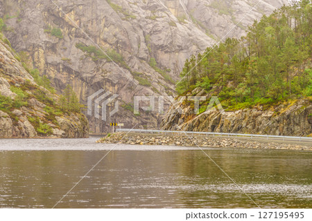 Road and fjord landscape in Norway Road and fjord landscape in Norway 127195495