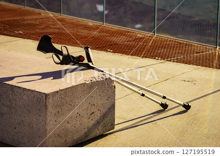 Crutches outdoor on bench. Crutches outdoor on bench. 127195519