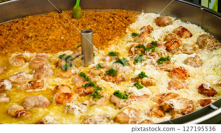 Cooked cabbage and pork knuckle in big pot. Cooked cabbage and pork knuckle in big pot. 127195536