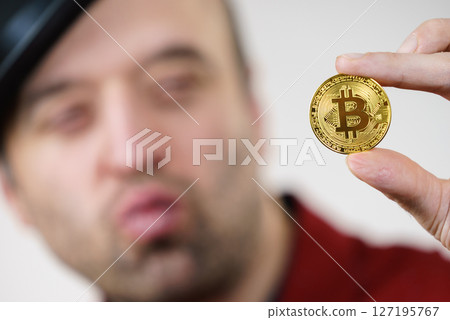 Man having bitcoin coin Man having bitcoin coin 127195767