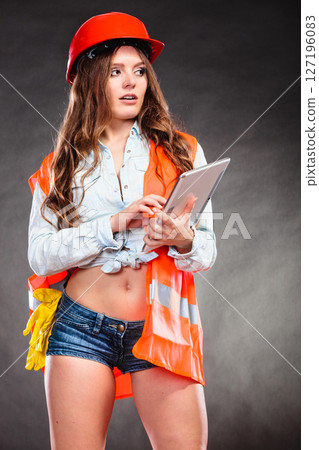 Woman structural engineer with tablet working. 127196083