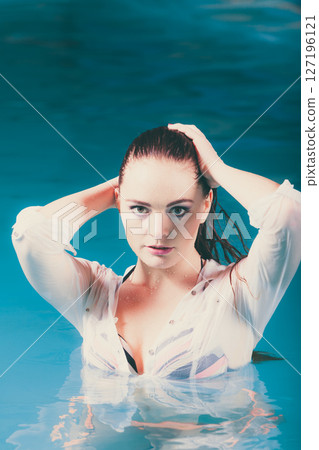 Portrait of mysterious seductive woman in water. 127196121