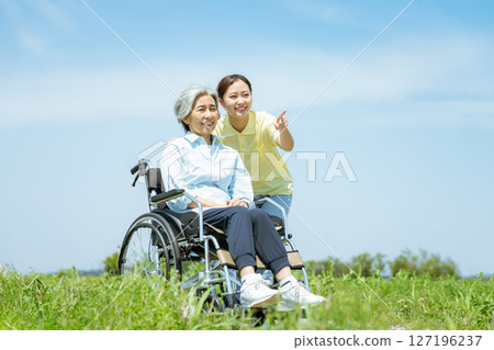 Wheelchair senior and caregiver Wheelchair senior and caregiver 127196237
