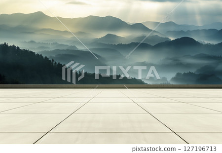 The brick-floored square platform has a backdrop of mountains 127196713