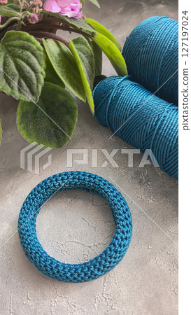 Knitting a cord product with a crochet hook. Step-by-step instructions. Knitting a cord product with a crochet hook. Step-by-step instructions. 127197024