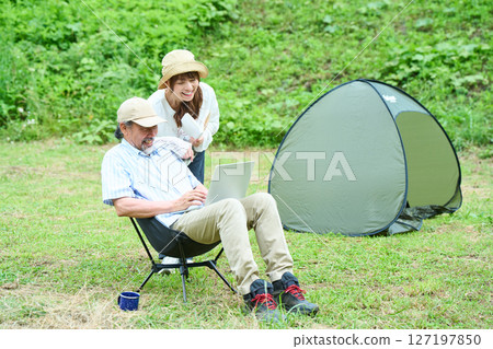 Mature couple hiking camping leisure middle senior Mature couple hiking camping leisure middle senior 127197850