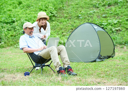 Mature couple hiking camping leisure middle senior Mature couple hiking camping leisure middle senior 127197860