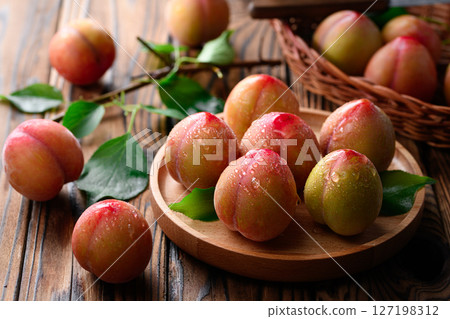 Sweet and sour, delicious plums (early) 127198312