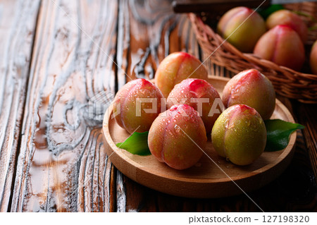 Sweet and sour, delicious plums (early) 127198320