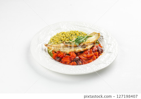 Portion of sea bass fillet with ptitim and tomato 127198407