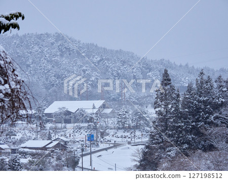 Winter Japanese countryside village and snowy mountain landscape Winter Japanese countryside village and snowy mountain landscape 127198512