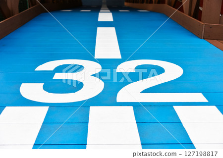 A blue walkway resembling a runway (Runway 32) A blue walkway resembling a runway (Runway 32) 127198817