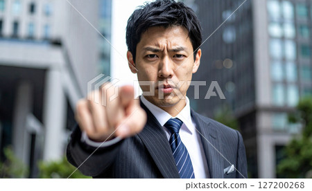 Angry businessman pointing his finger (AI generated image) 127200268