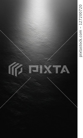 Black textured vertical background with light coming from above 127200720
