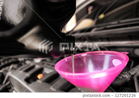 Engine oil or motor oil, is being poured Engine oil or motor oil, is being poured 127201216