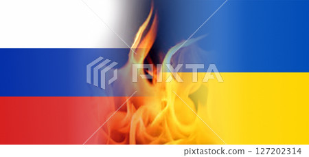 Conflict, war in Ukraine. Ukraine and Russian flags with flames between. 127202314