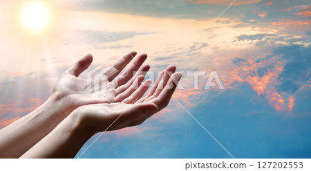 The outstretched hands of a praying man The outstretched hands of a praying man 127202553