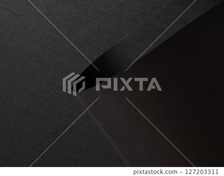 Black matte paper texture with a rich, premium finish, featuring wavy folds and edges. Elegant, Black matte paper texture with a rich, premium finish, featuring wavy folds and edges. Elegant, 127203311