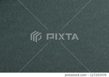 Premium dark green paper texture with a matte finish. Soft, fibrous surface with a natural, 127203476