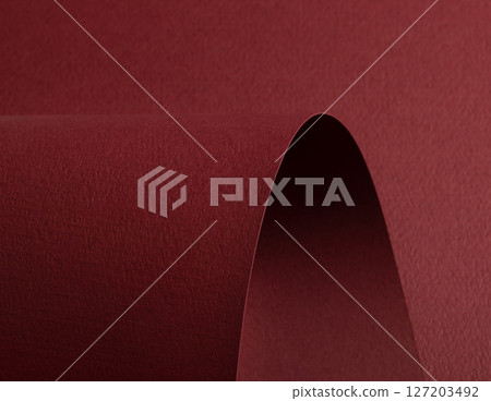 Premium red and burgundy paper texture with a matte finish. Dark, wavy edges and rolled folds create 127203492