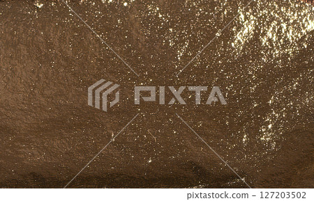 Shiny metallic foil texture with a sleek, pearlescent finish. Bright, glimmering surface with a Shiny metallic foil texture with a sleek, pearlescent finish. Bright, glimmering surface with a 127203502