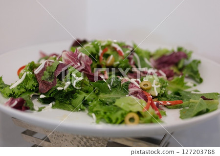 Develop healthy habits with this vibrant video showing a person enjoying a fresh green salad. Ideal for promoting clean eating, gut health, and mindful nutrition. Develop healthy habits with this vibrant video showing a person enjoying a fresh green salad. Ideal for promoting clean eating, gut health, and mindful nutrition. 127203788