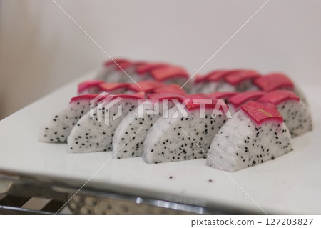 Pitaya isolated. Ripe slices of dragon fruit or pitahaya on a white background. Pitaya isolated. Ripe slices of dragon fruit or pitahaya on a white background. 127203827